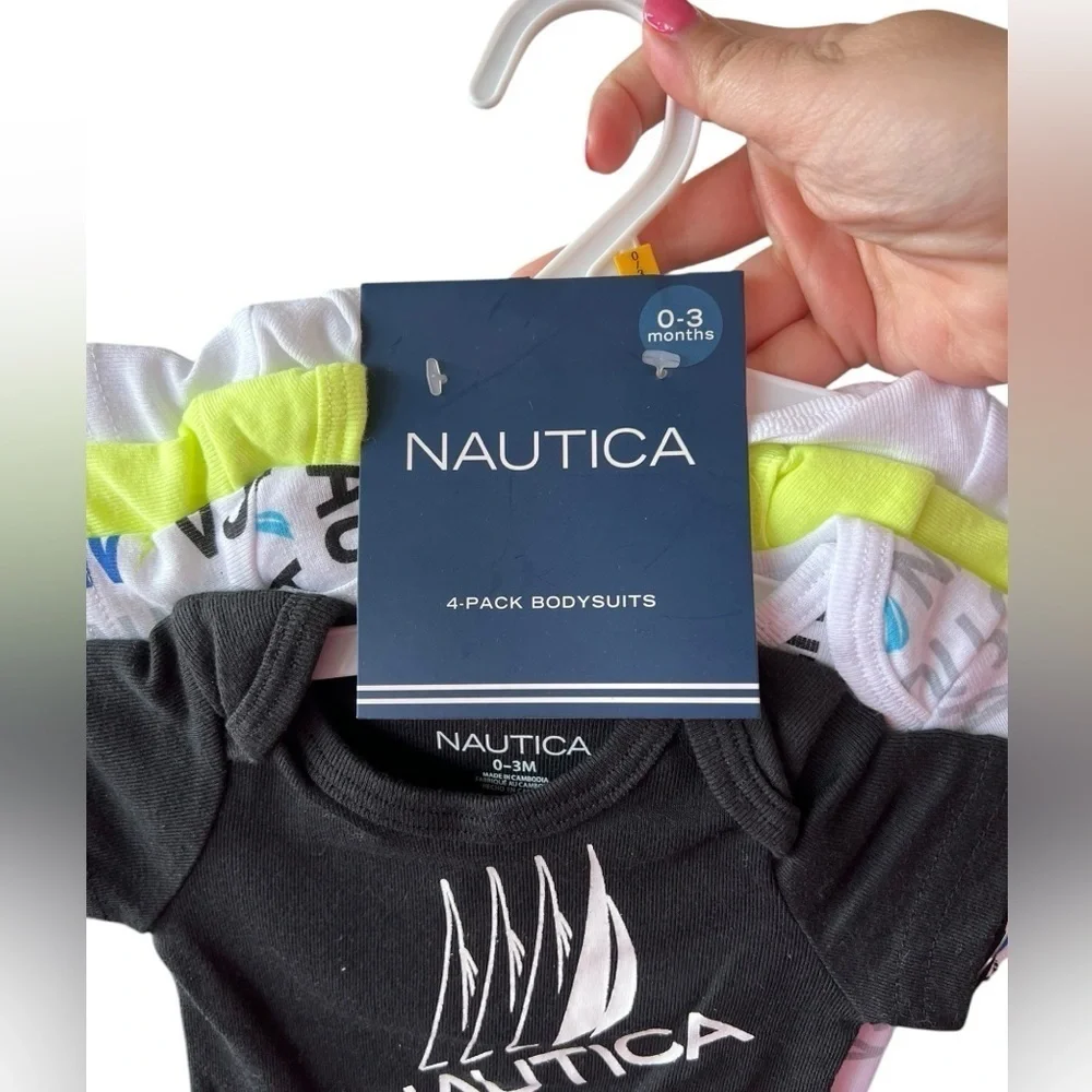 NWT Nautica Baby Boy Set of 4 onesies in size 0 to 3 months